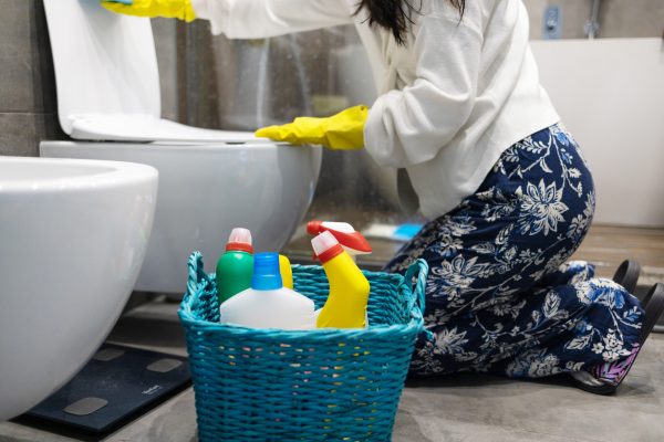 woman-in-yellow-rubber-gloves-cleaning-toilet-with-2026-01-09-06-23-26-utc